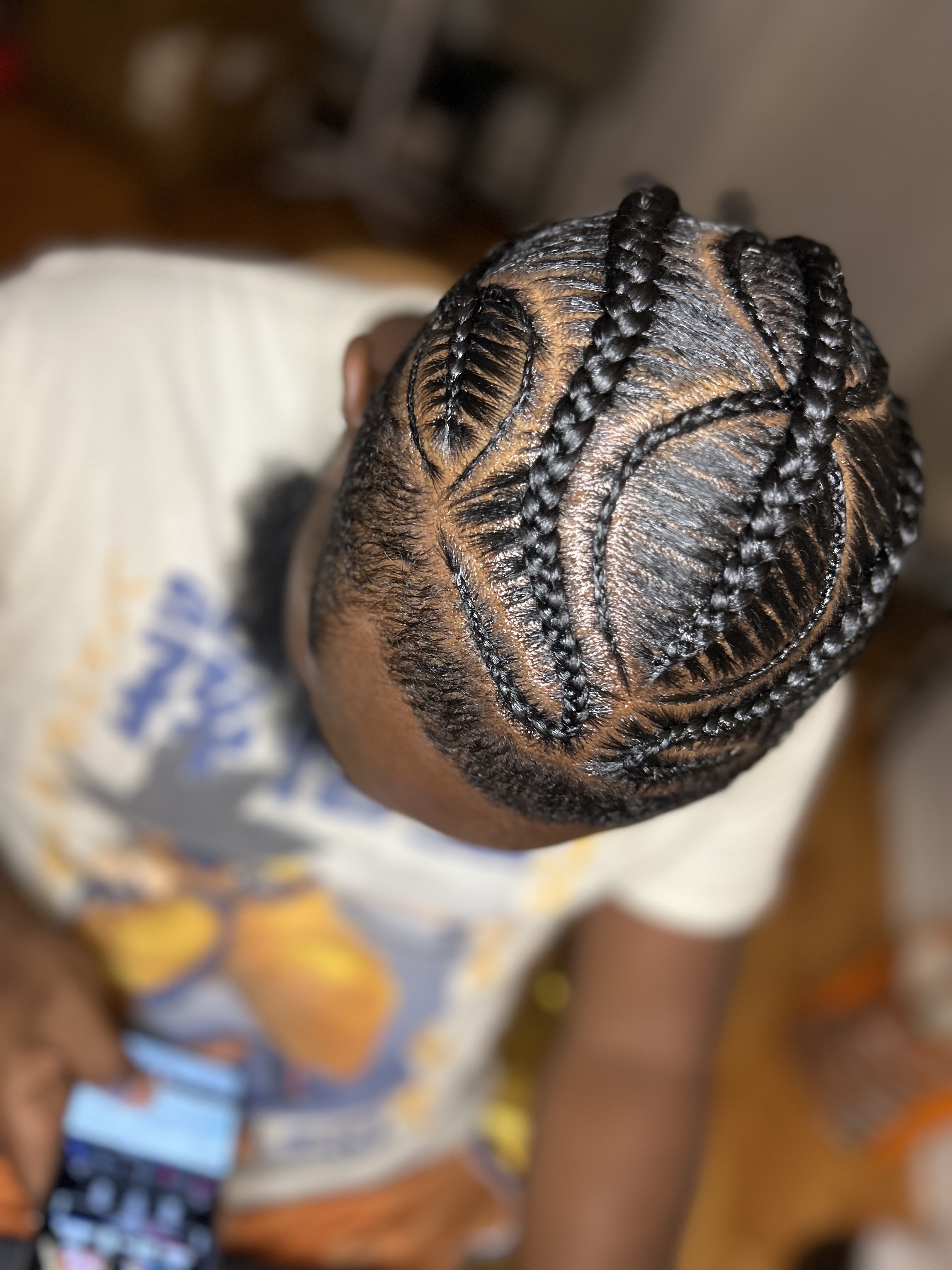 Neat feed-in braids with pink and blue accents